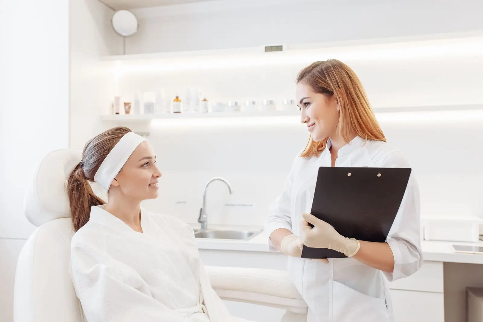 Beautician consulting a client