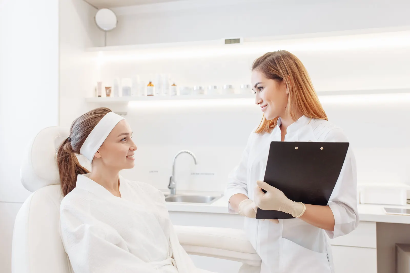 Beautician consulting a client