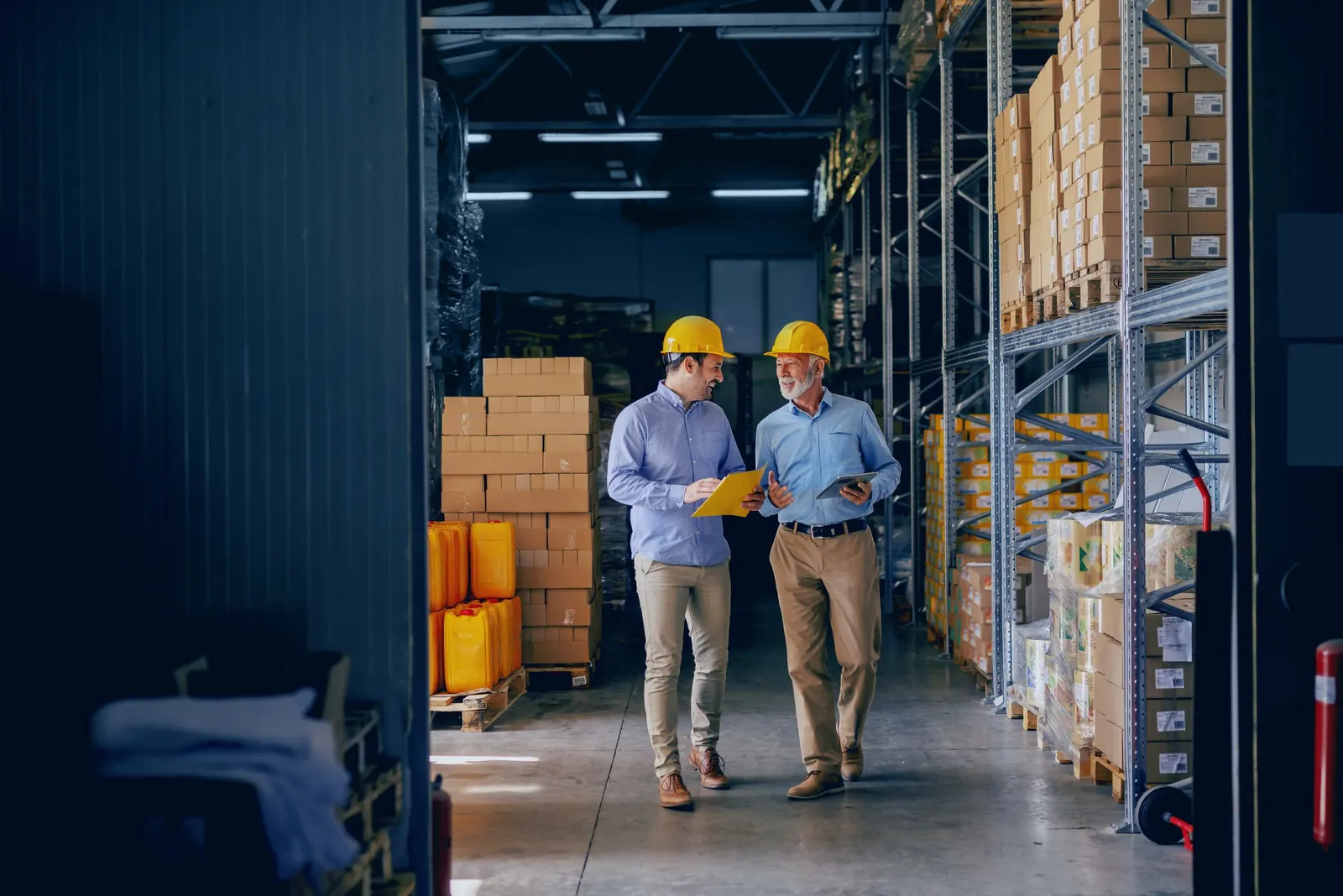 Business partners walking their warehouse