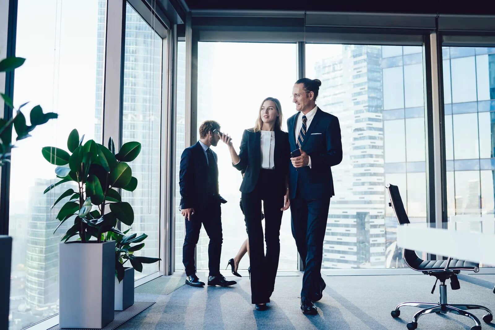 Colleagues walking through an office