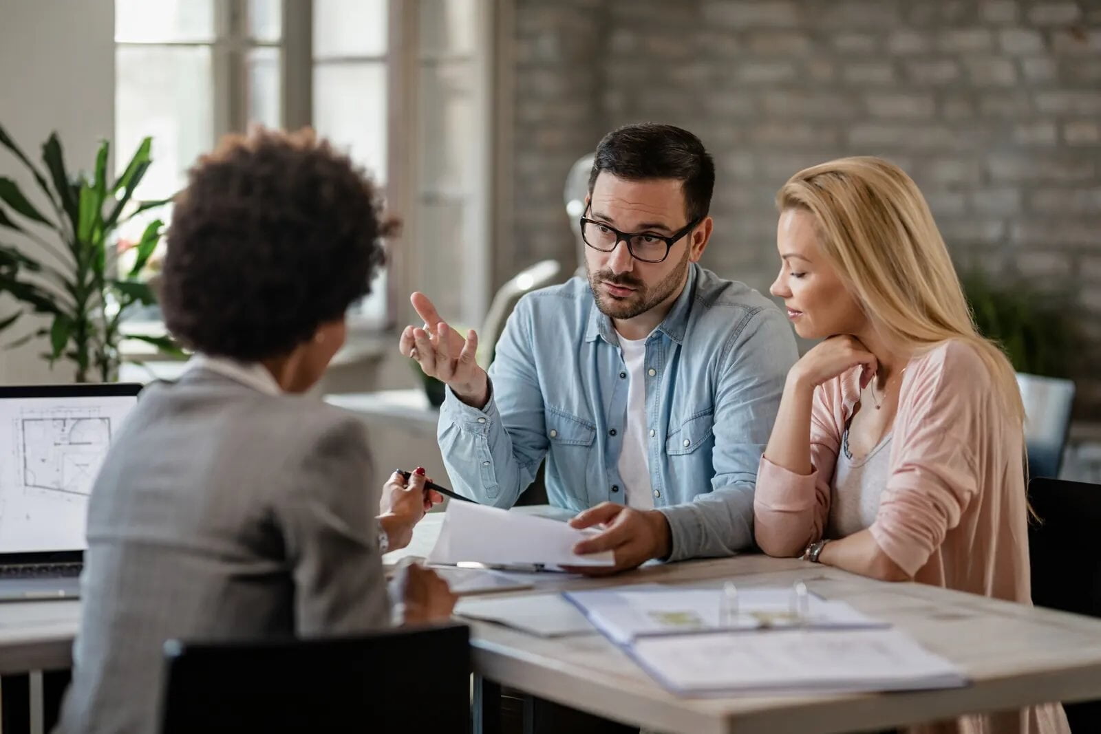 Couple reviewing plans with an advisor