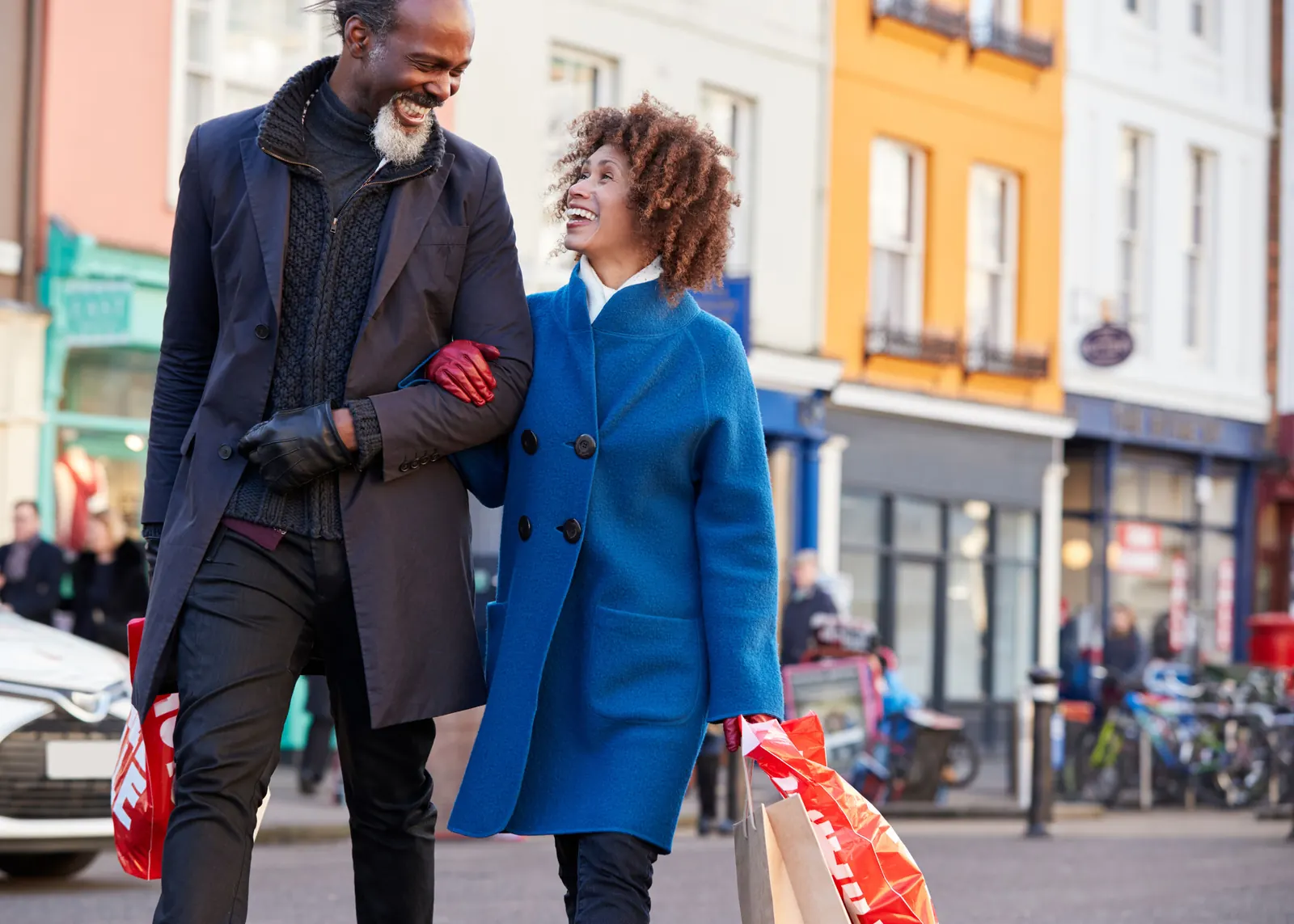 Couple shopping on a street of storefronts