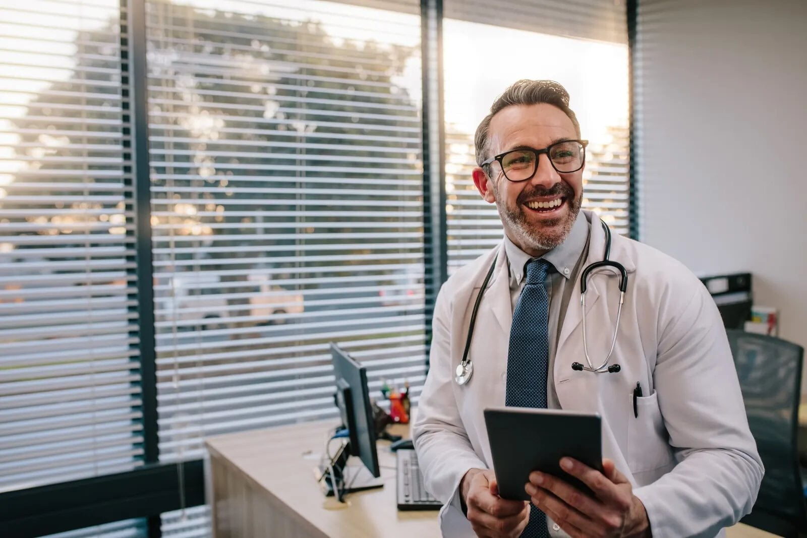 Doctor with a tablet in his office