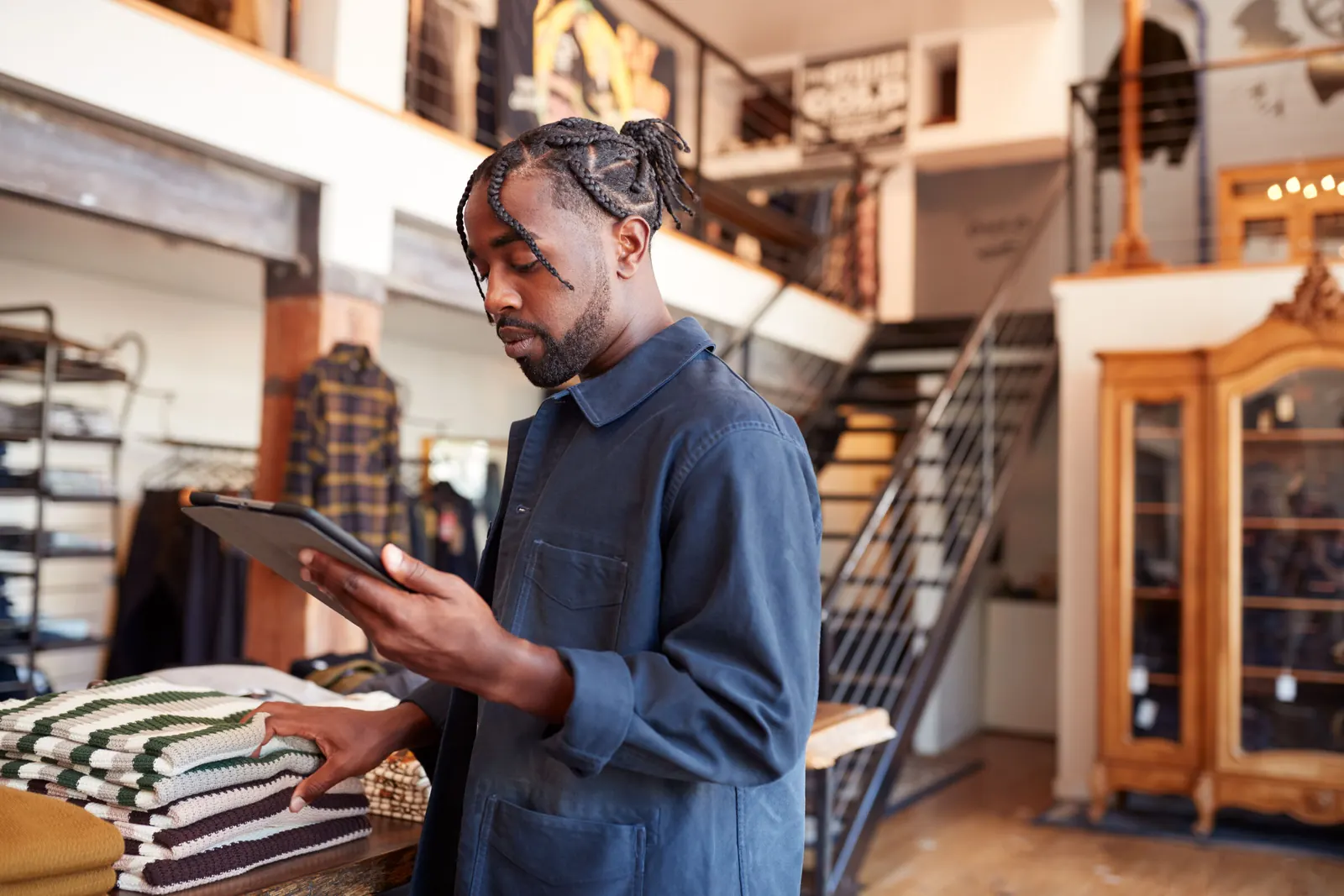 Fashion store owner checking stock