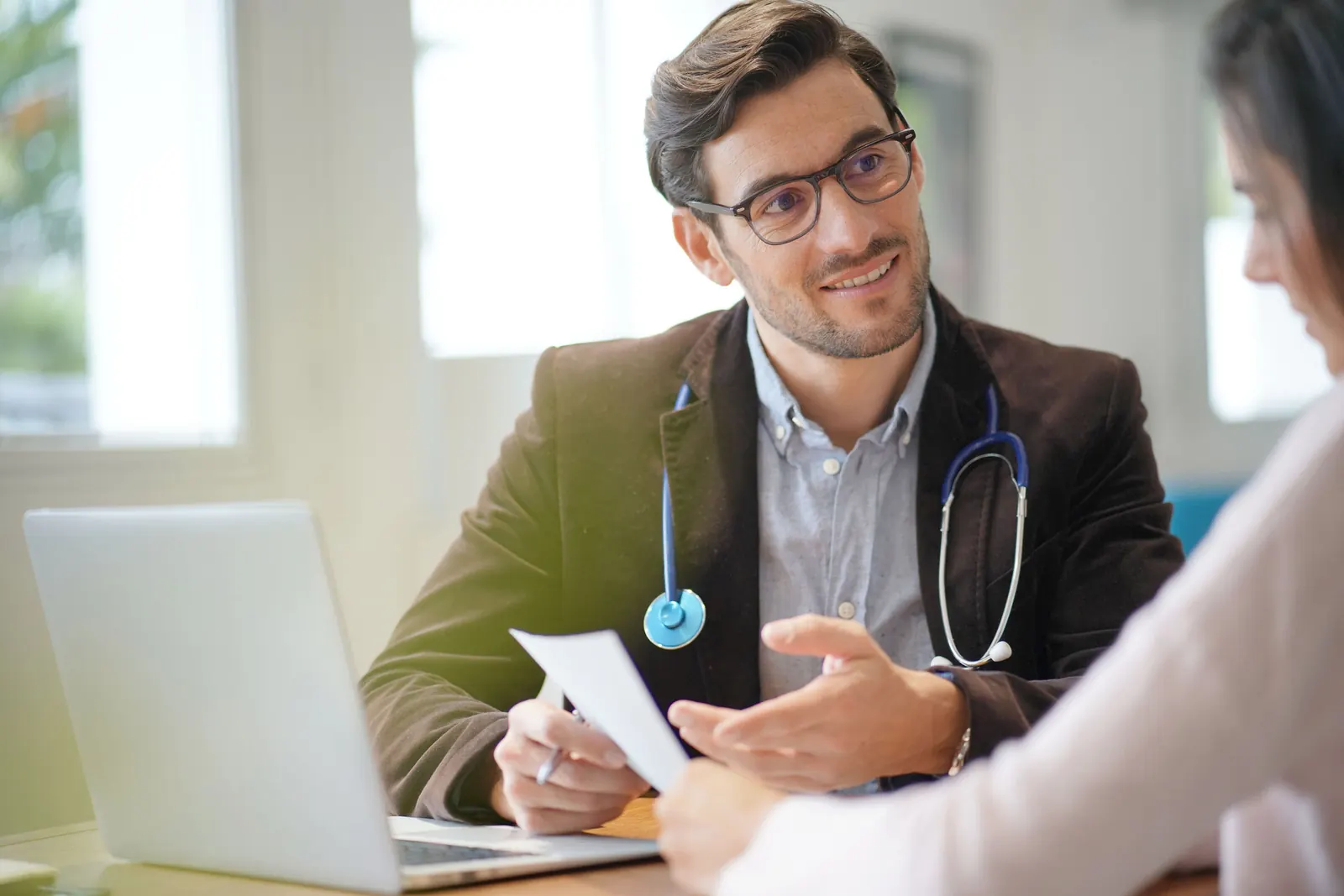 Physician consulting with a patient