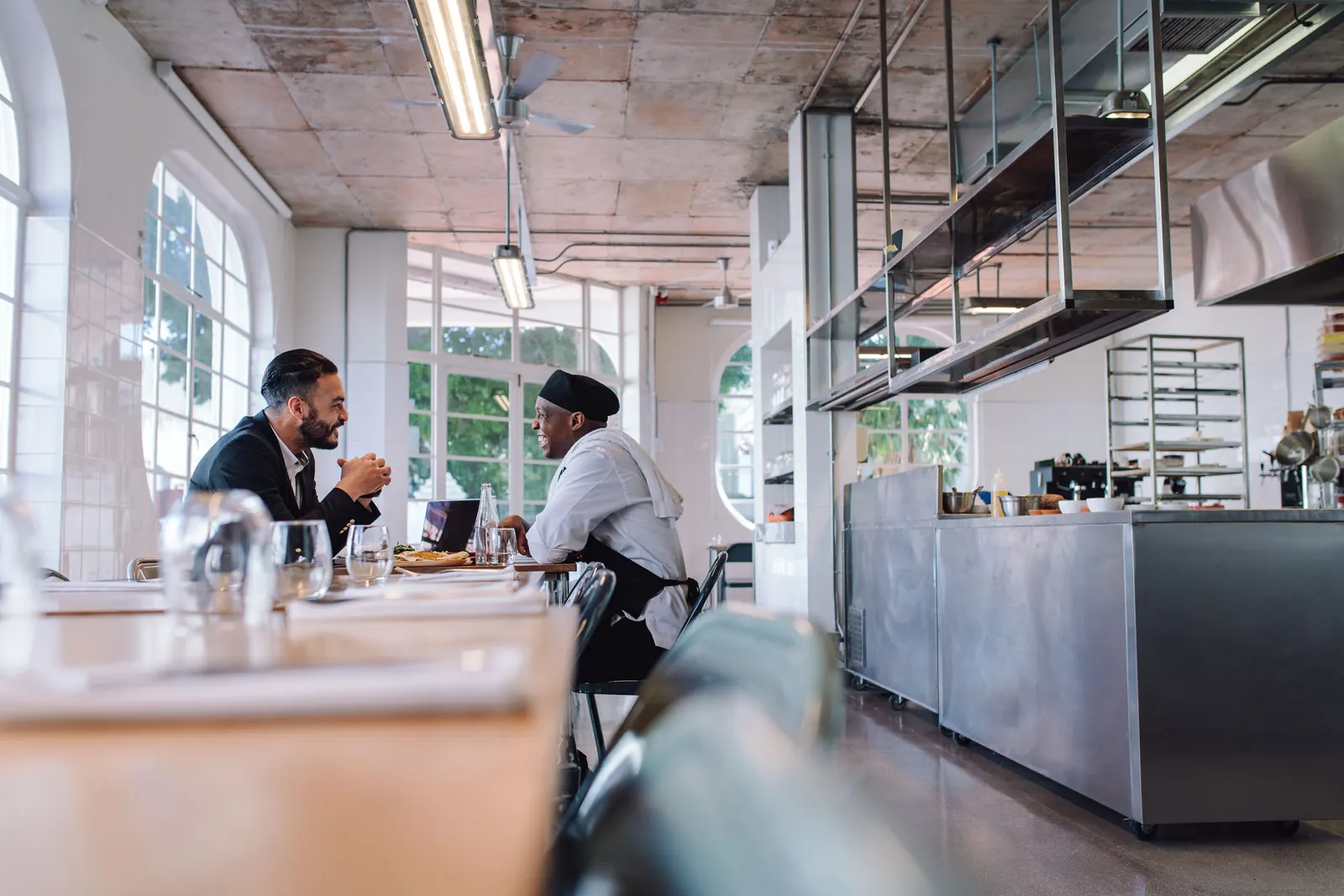 Restaurant manager talking with the chef