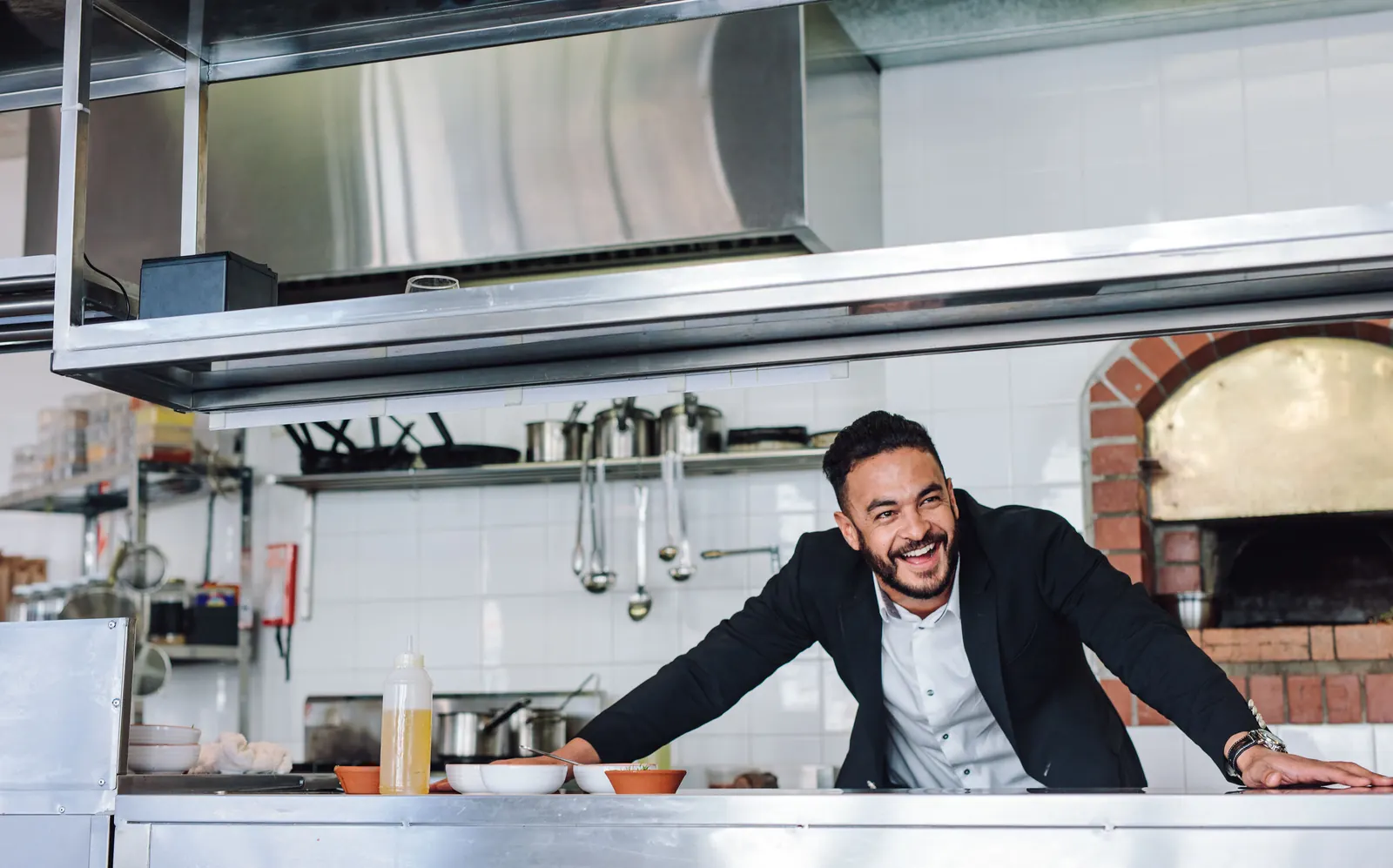 Restaurant owner at his kitchen counter