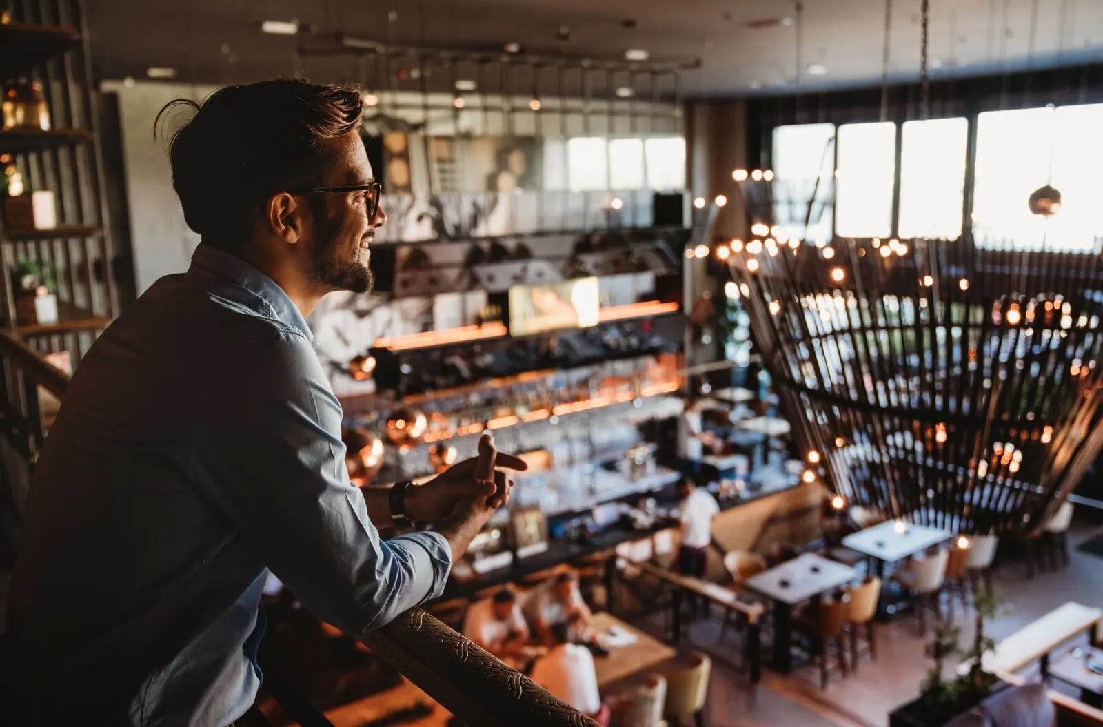 Restaurant owner overlooking a full room