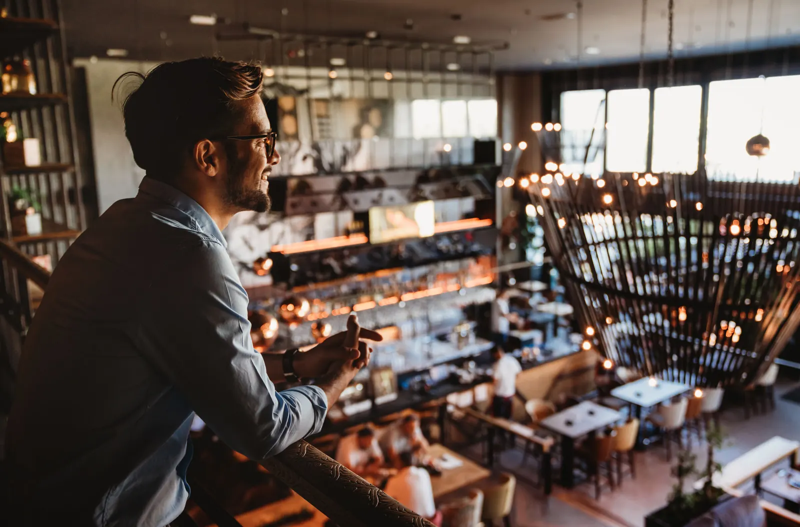Restaurant owner overlooking a full room