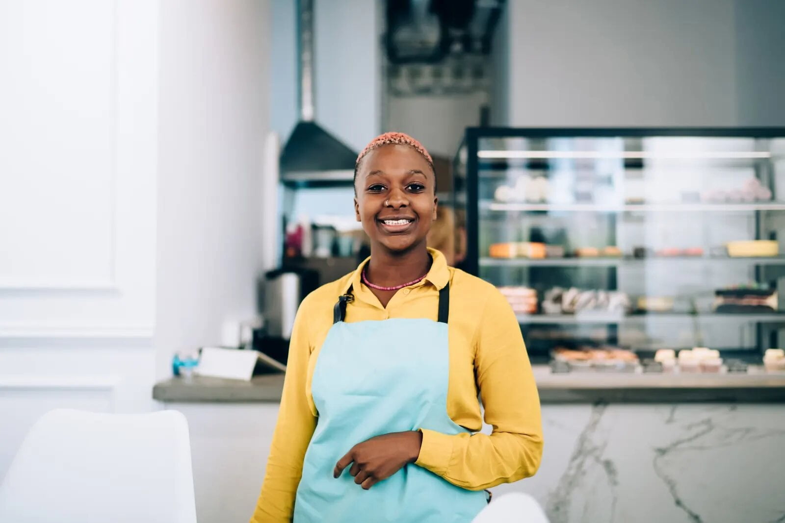 Shop owner behind her counter