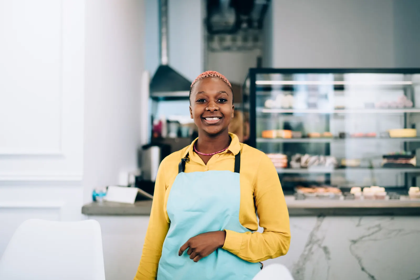 Shop owner behind her counter