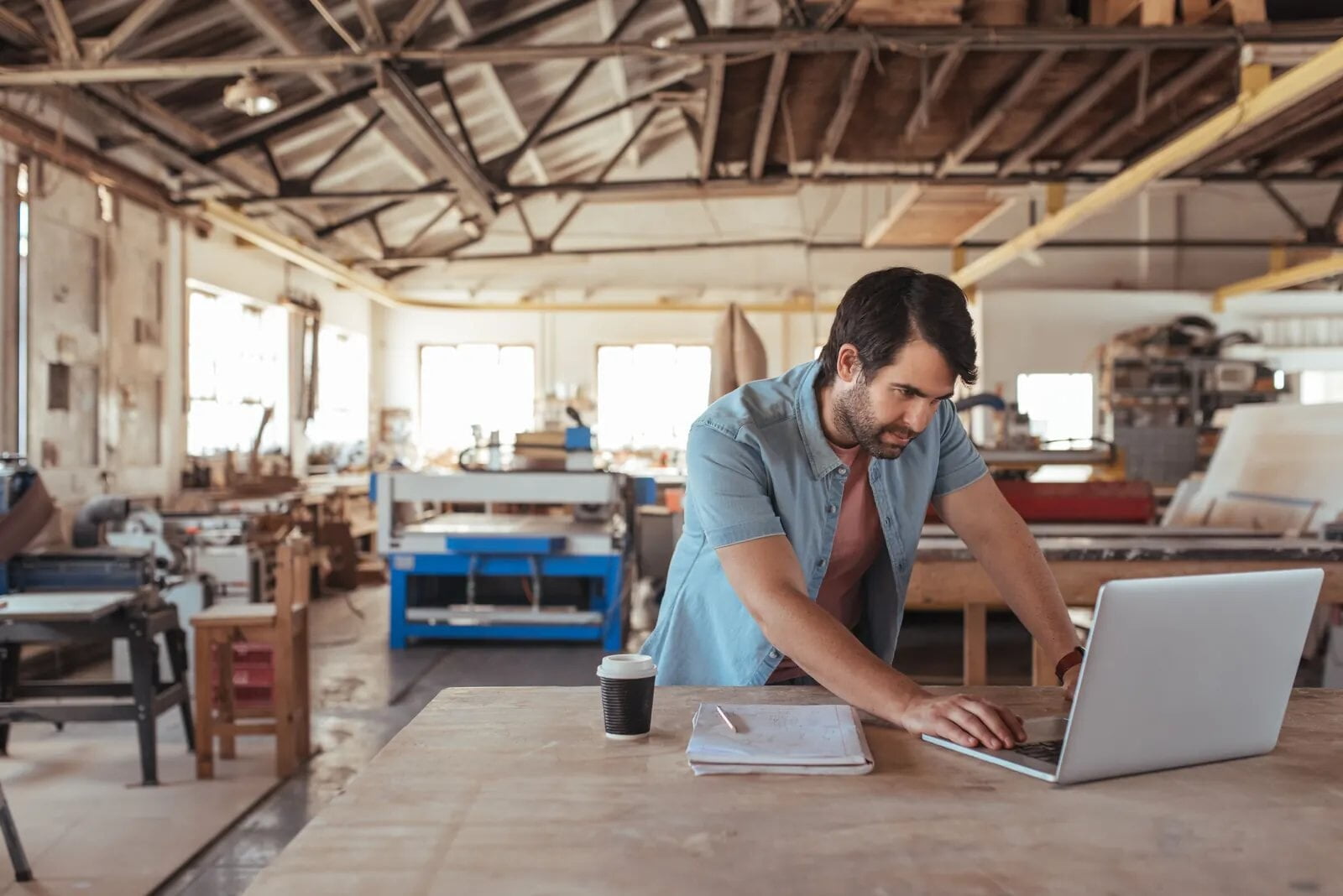 Woodworker at his workshop desk