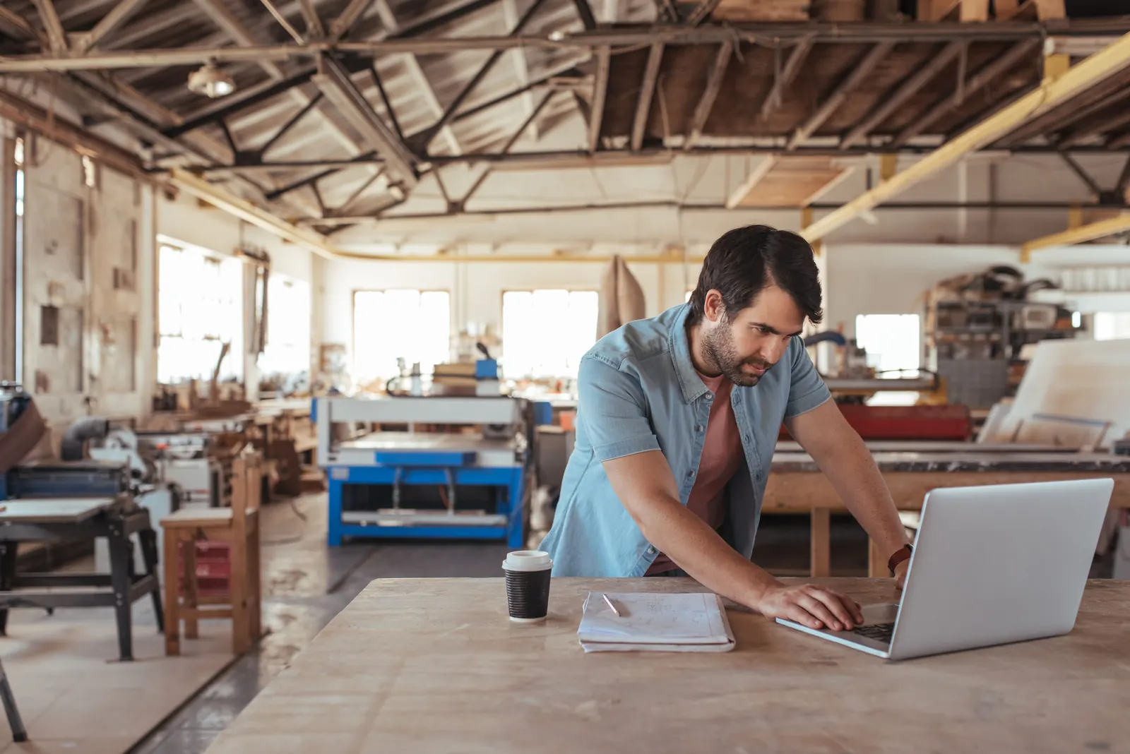 Woodworker at his workshop desk